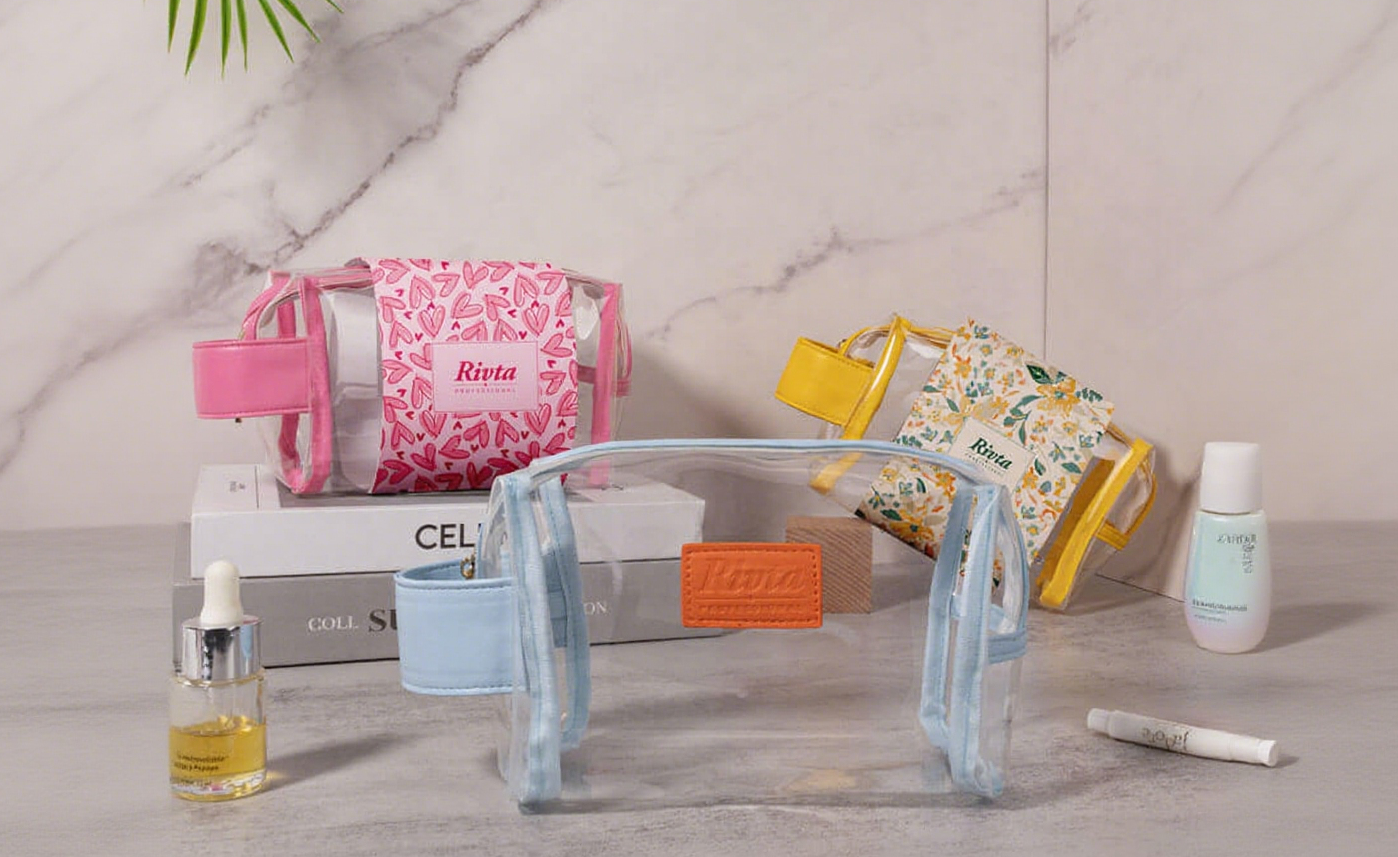 A collection of customized clear makeup bags showing different logos, colors, and zipper pulls.