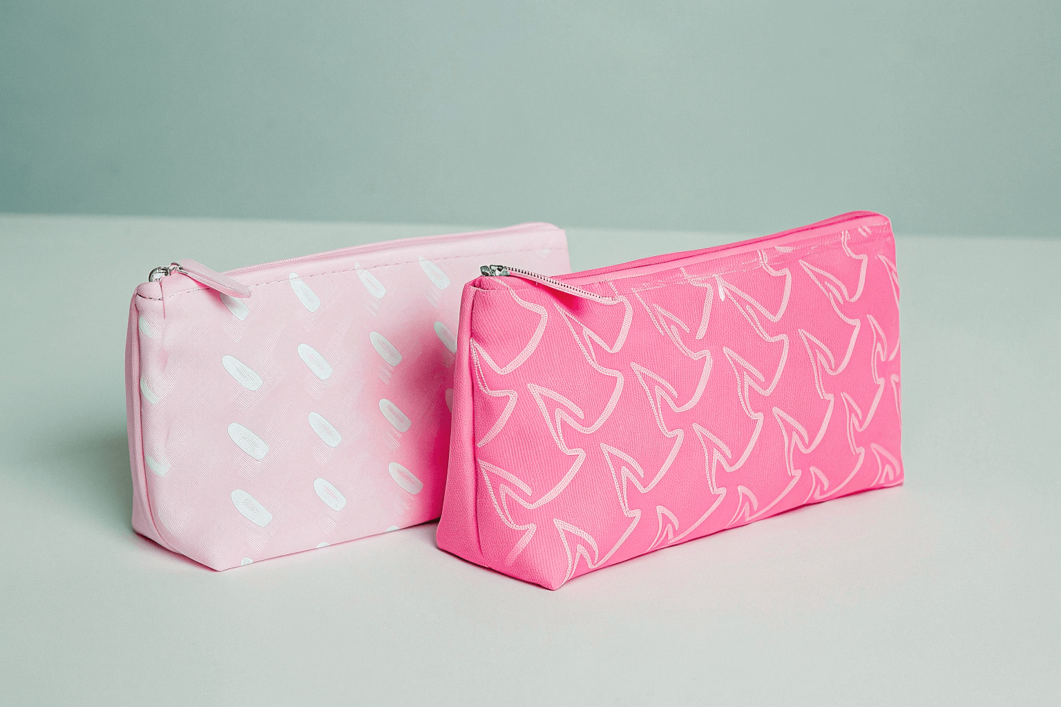 The Cost Impact of Customization A comparison shot of cosmetic bags featuring different levels of customization, from a simple screen print to a bag with custom hardware