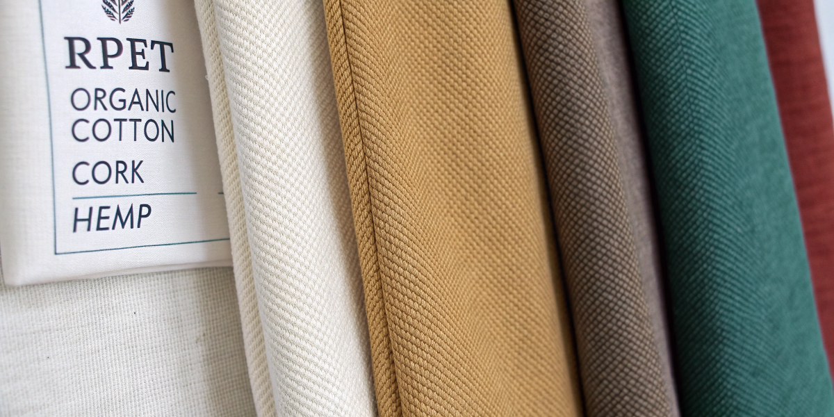 Top Eco-Friendly Materials for Bags Fabric swatches of top eco-friendly materials like RPET, organic cotton, cork, and hemp